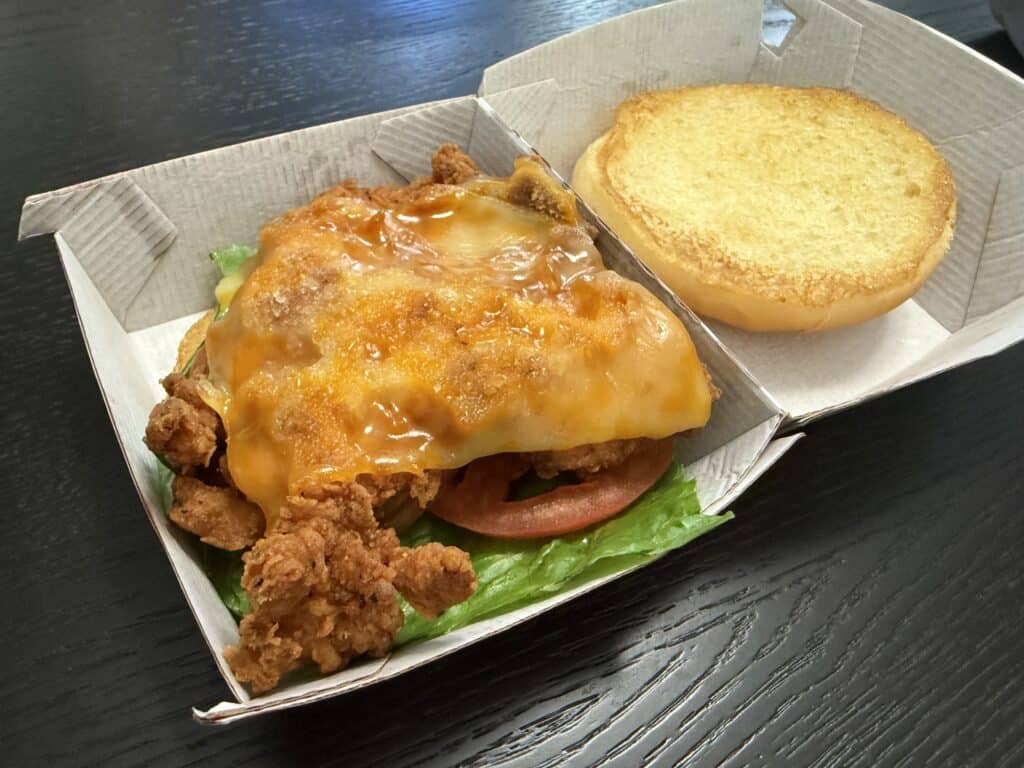 Chick-fil-A Spicy Deluxe Sandwich In Box Opened Up With Bun Off